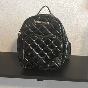 Black Betsey Johnson, backpack purse.